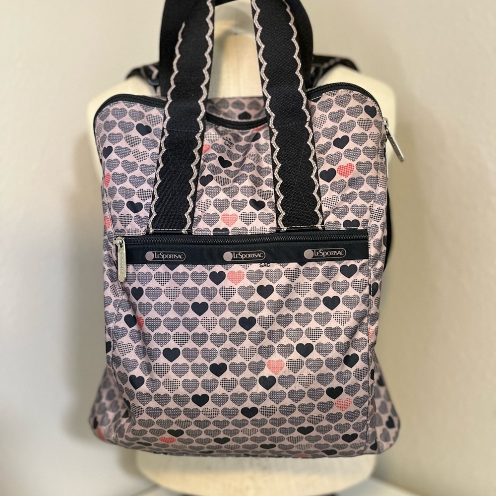 LeSportsac Heart Pattern Backpack - Black and Gray with red accents.